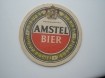 1 bierviltje Amstel - Man met glas bier op steekwagen