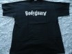 Nieuw zwart T-shirt met print van Bodyguard (maat: XL).