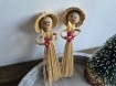 Twee vintage kerst meisjes met kaars